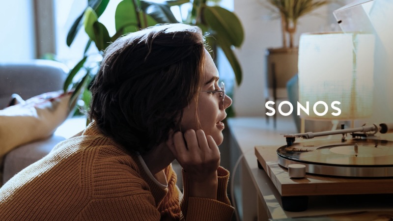 A person enjoying music from a Sonos turntable