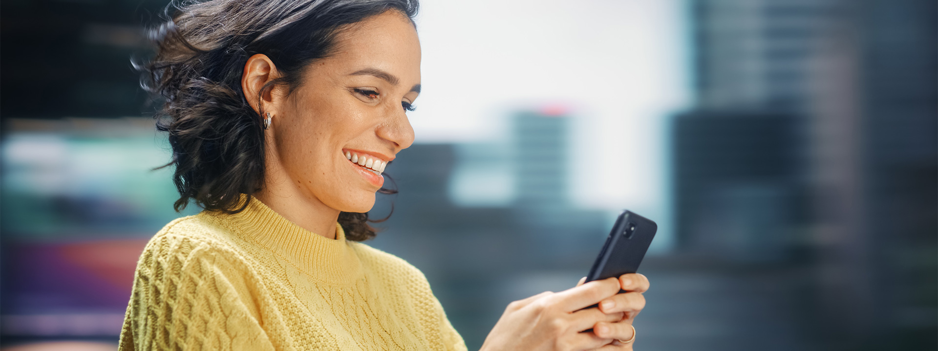 Portrait of woman using her smartphone