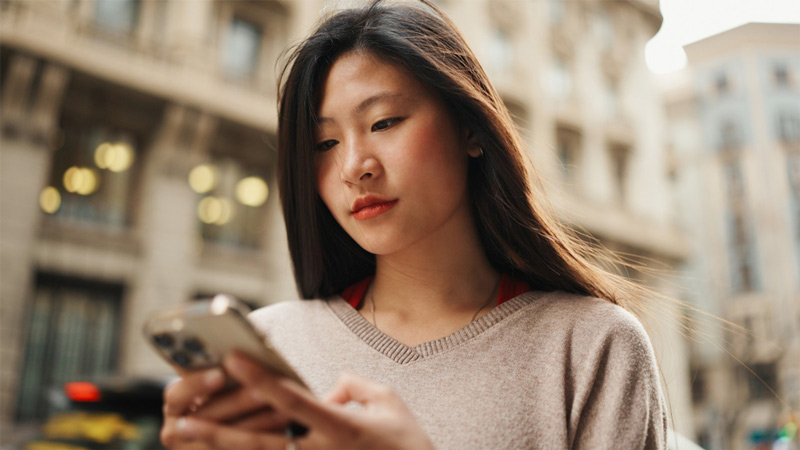 Portrait shot of a woman using her smartphone