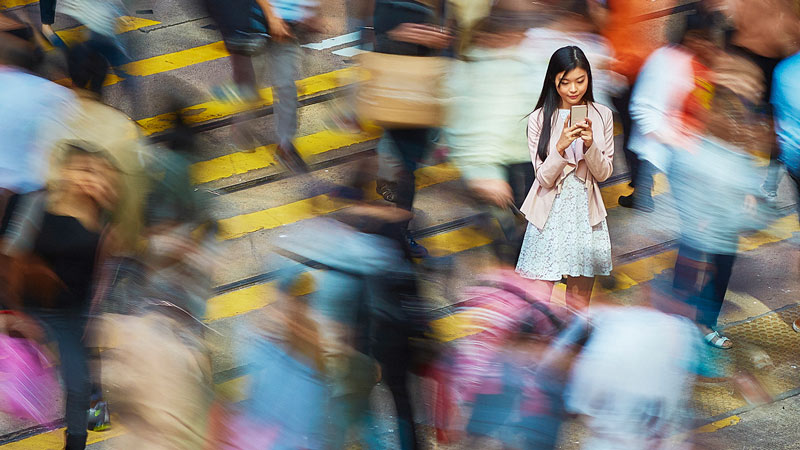 Woman outside looking at her phone